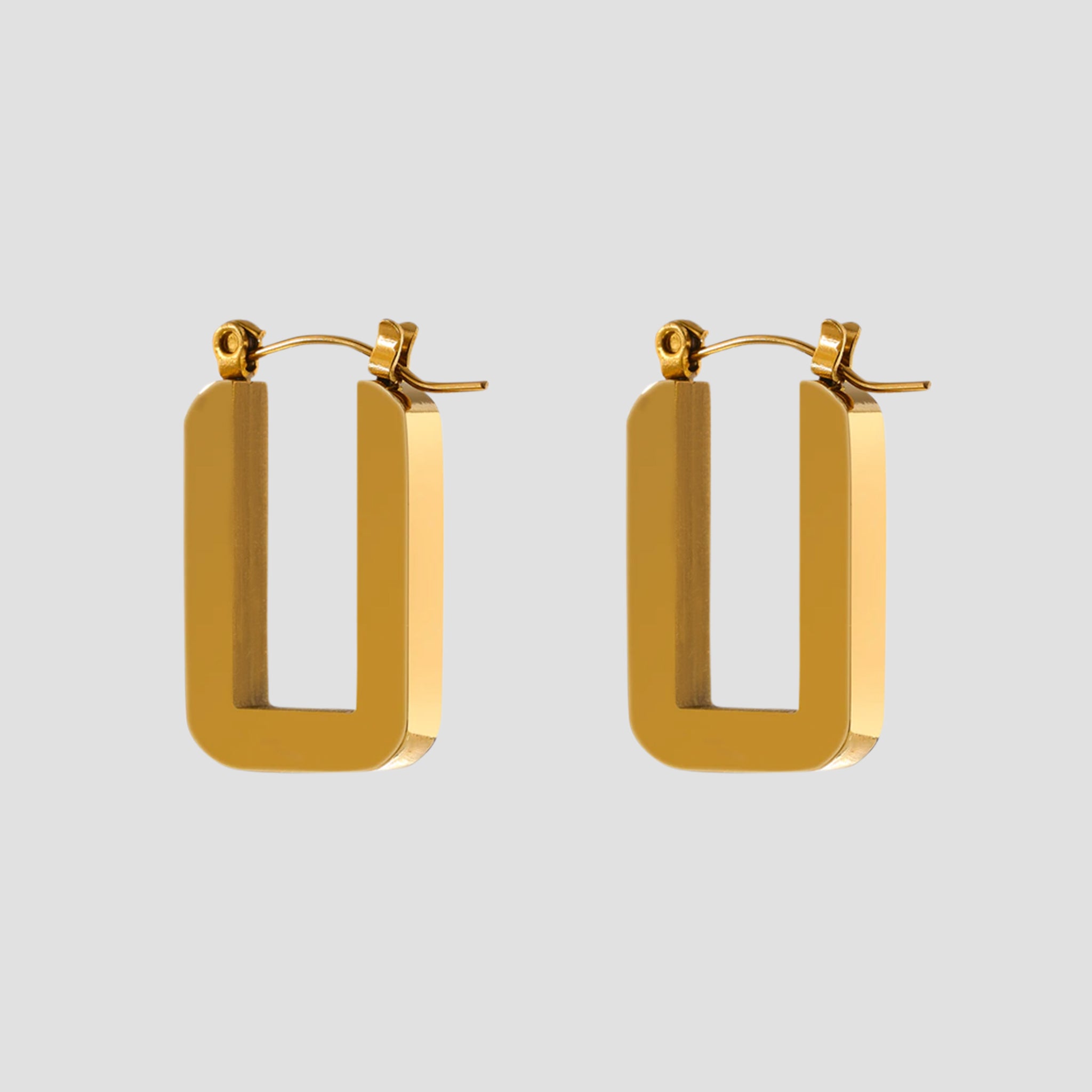 18k gold plated rectangle hoop earrings by GRISÉ NYC in high polish stainless steel with bold geometric rectangular design.