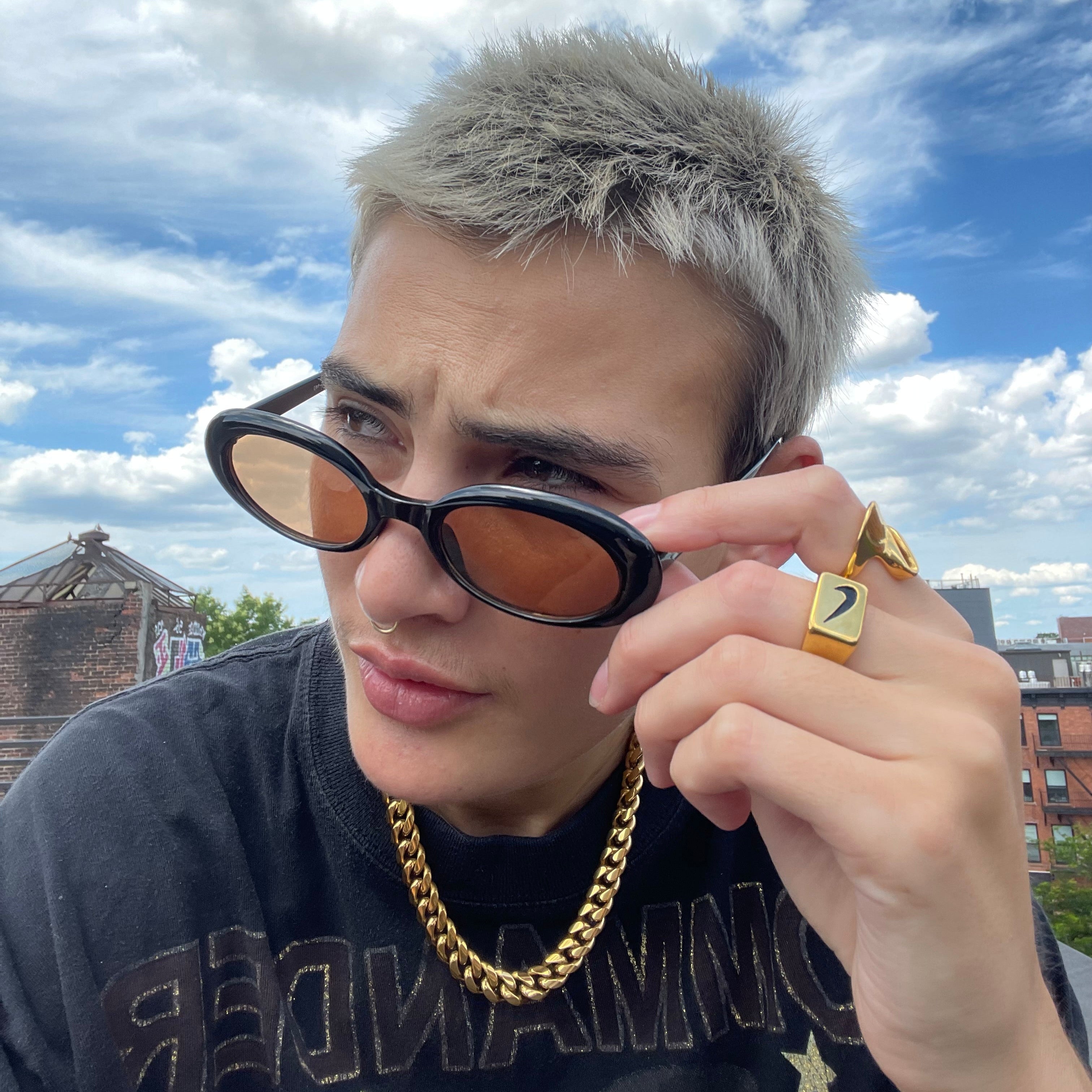 18k gold thick cuban link necklace styled for streetwear by GRISÉ NYC