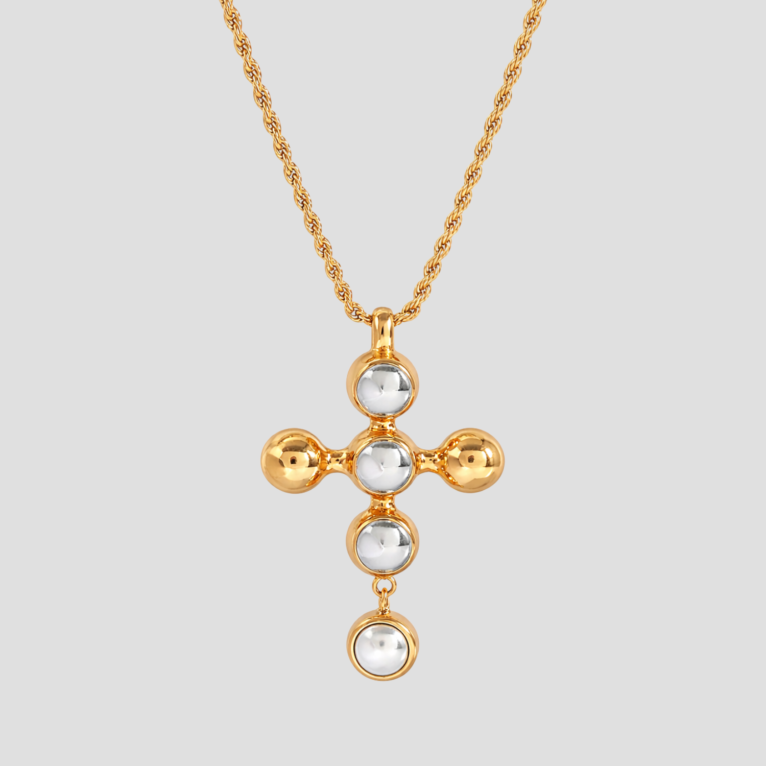 Radiant 2-Tone Harmony Cross Pendant Necklace in 18k gold plated stainless steel with polished steel cabochons and pearl drop detail by GRISÉ NYC.