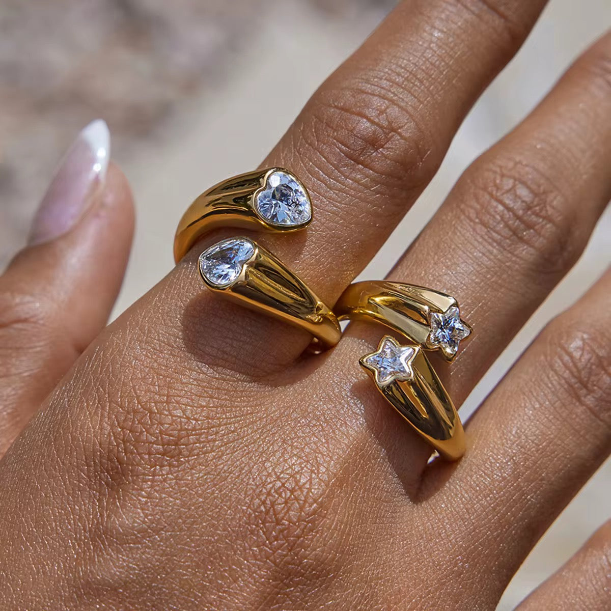 Model wearing Double Star Gemstone adjustable ring in 18k gold plated stainless steel by GRISÉ NYC.