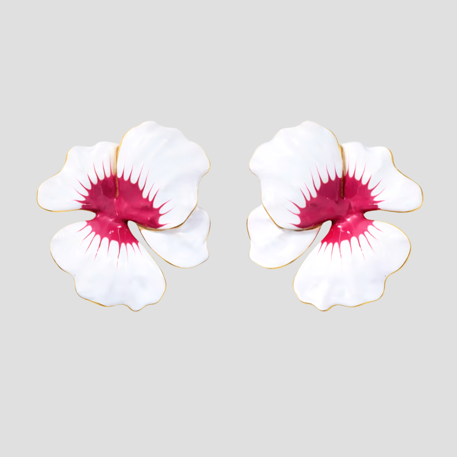 Enamel flower earrings in 18k gold plated stainless steel by GRISÉ NYC on grey background.