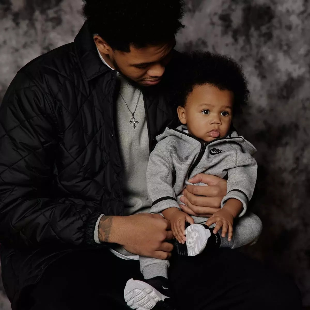 Anfernee Simons with his son wearing Lumière cross pendant necklace