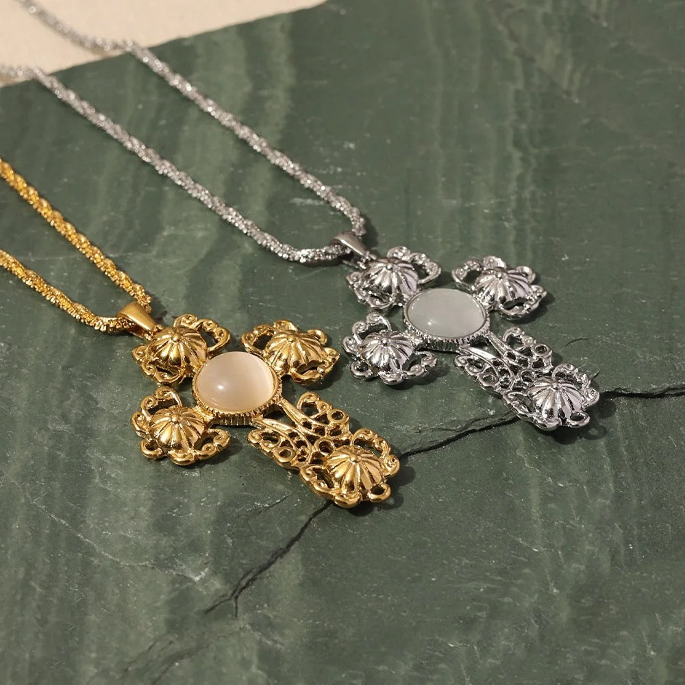 GRISÉ NYC gold and silver baroque cross necklaces side by side showing filigree craftsmanship.