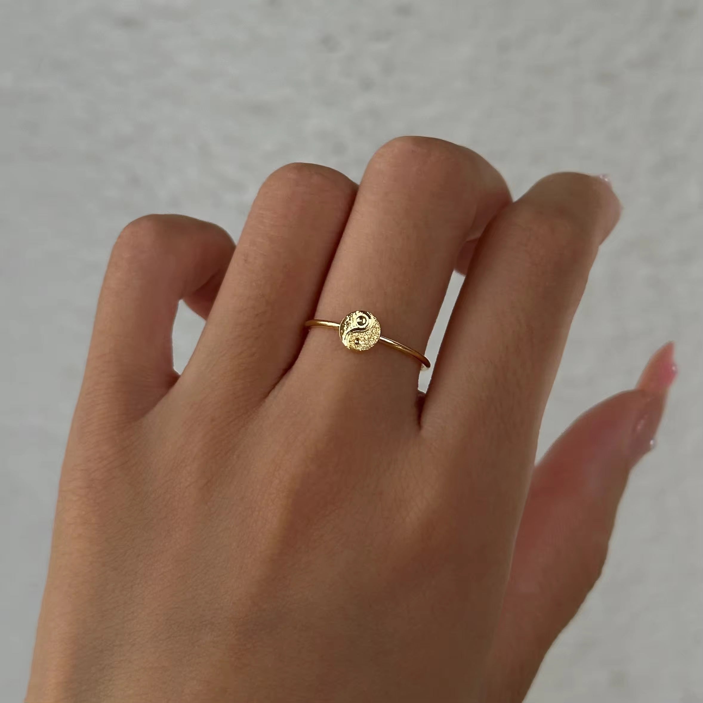 Close-up of the GRISÉ NYC Dainty Ying Yang 18k Gold Ring, a waterproof, tarnish-resistant minimalist gold ring.