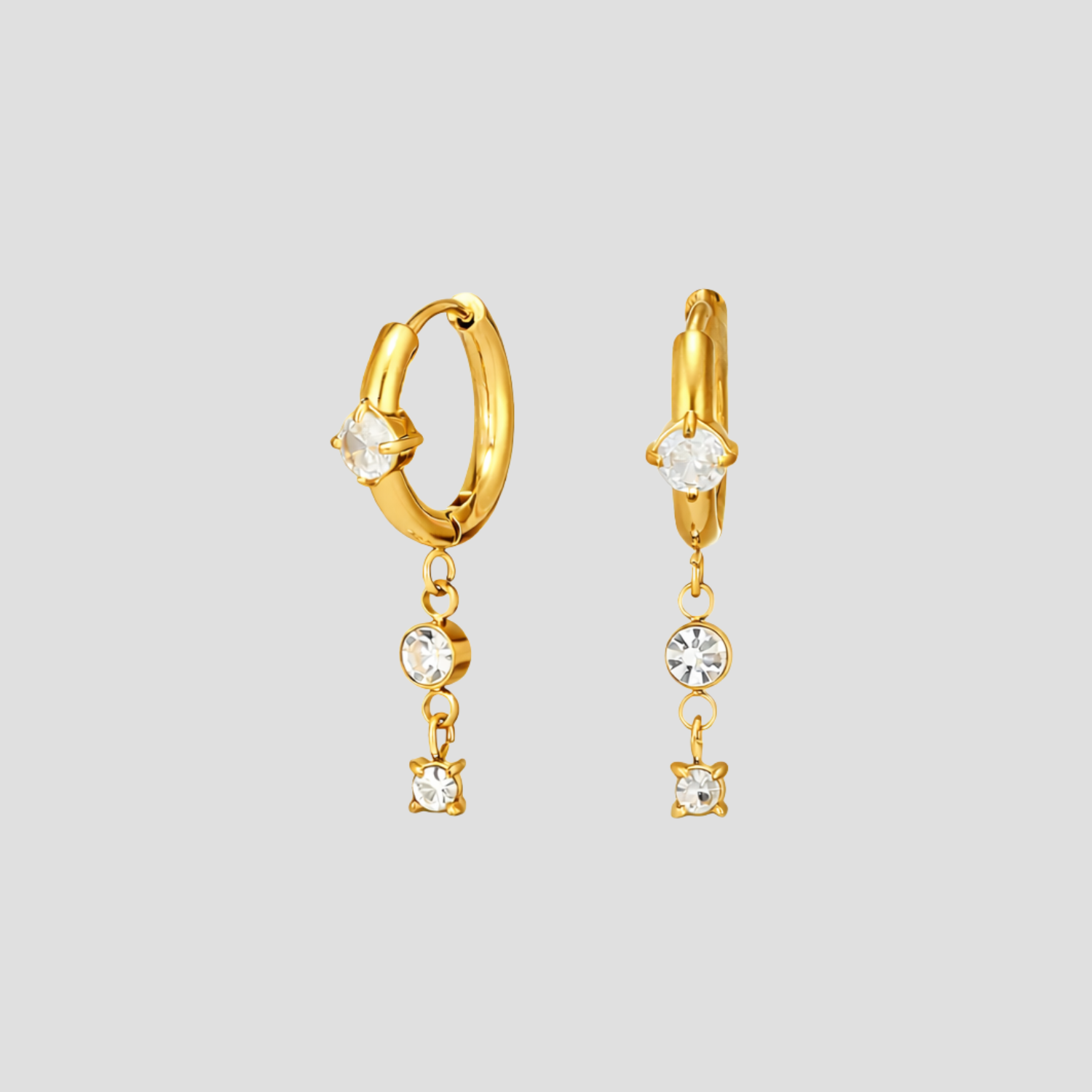 GRISÉ NYC dangle gemstone hoop earrings in 18k yellow gold with cubic zirconia drop stones.