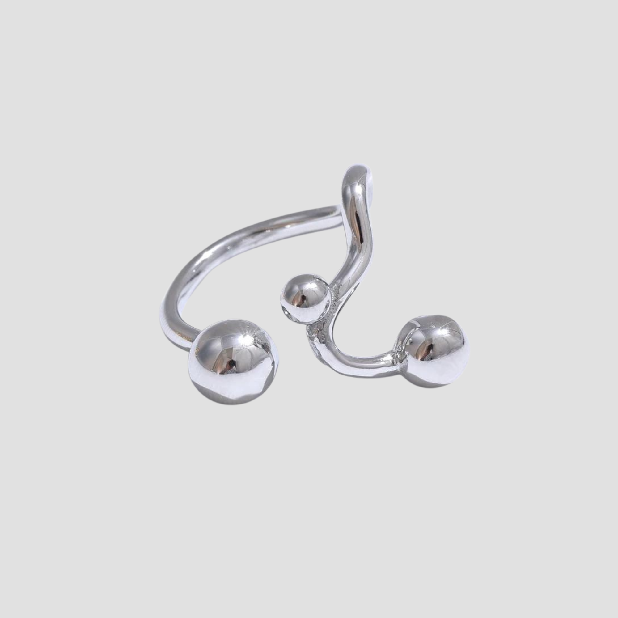 GRISÉ NYC Dots Stainless Steel Adjustable Ring featuring a polished silver open band with modern sphere accents and an adjustable minimalist design.