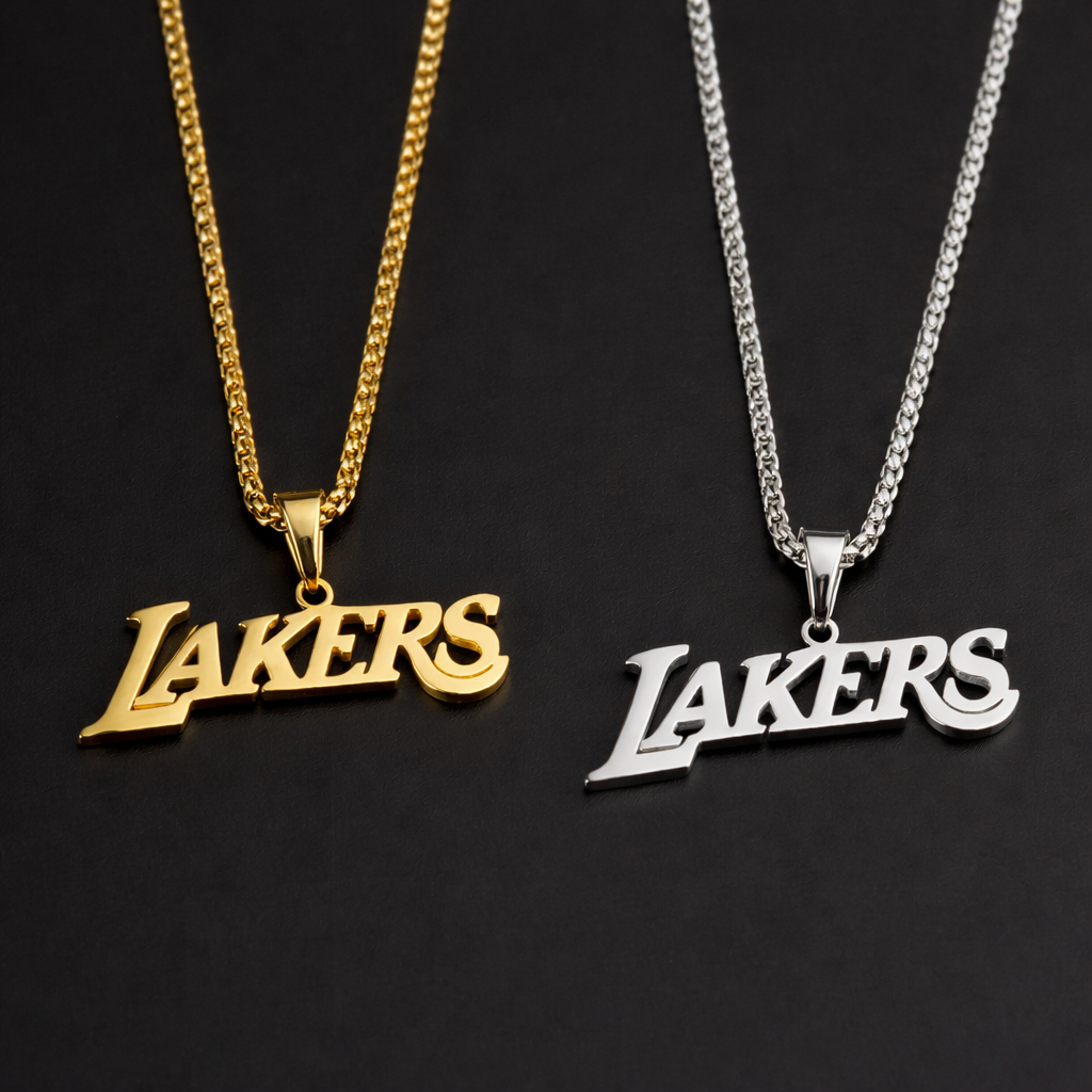 GRISÉ NYC Lakers gold and silver box chain necklaces with script pendants on black background inspired by basketball culture