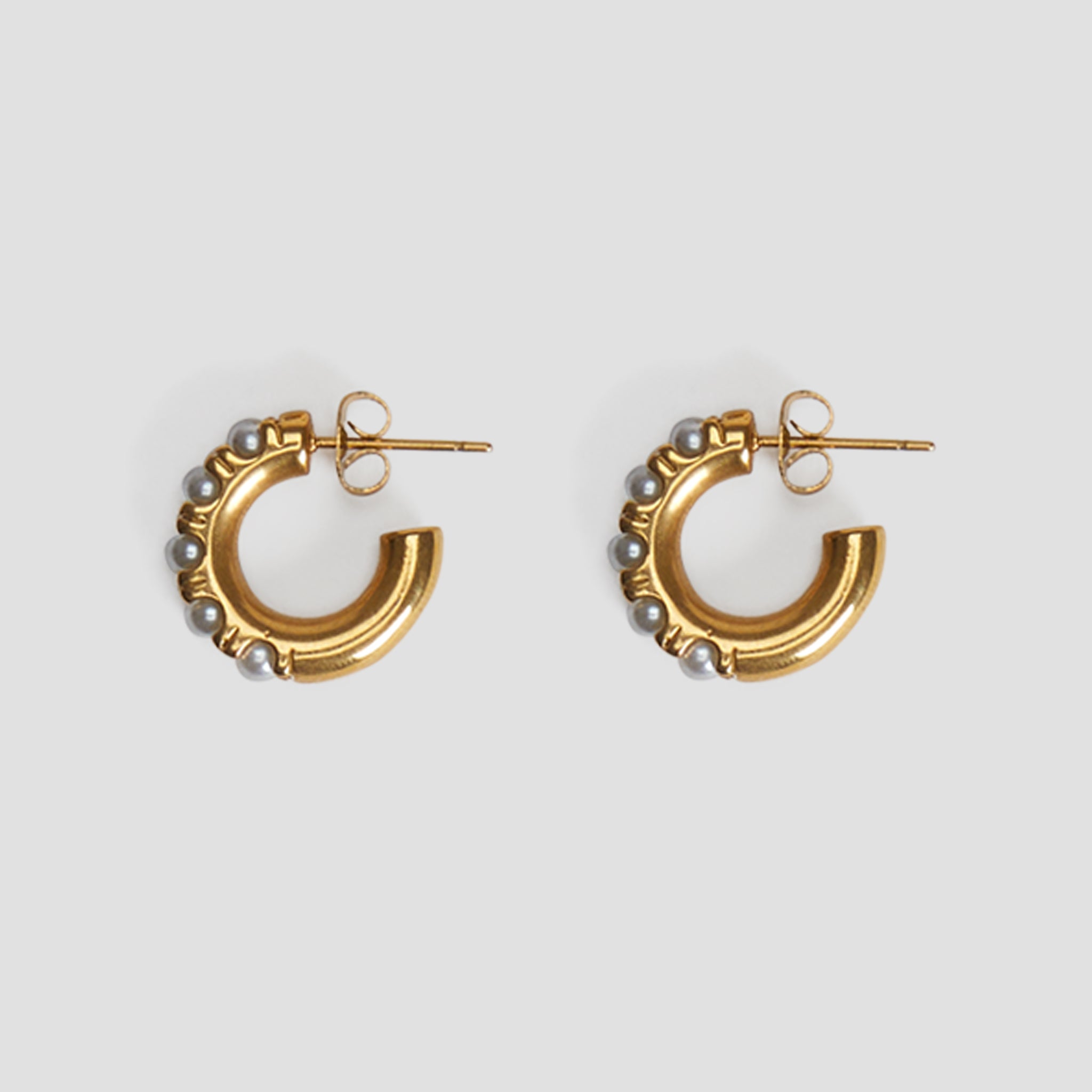 Mini midi pearl hoop earrings in 18k gold plated stainless steel with simulated pearls by GRISÉ NYC.