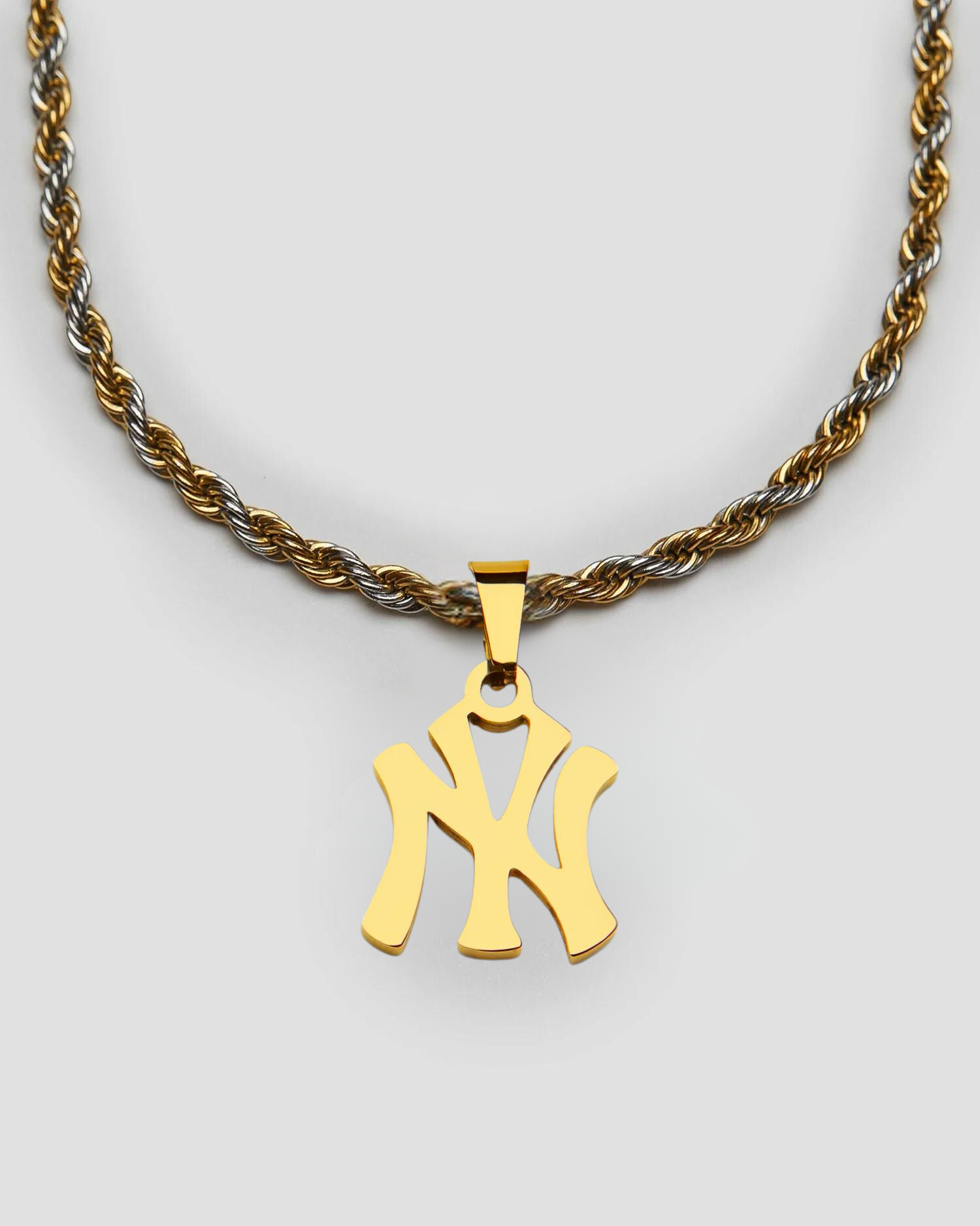 GRISÉ NYC NY Yankees pendant necklace in 18k gold plated stainless steel on 2 tone rope chain.