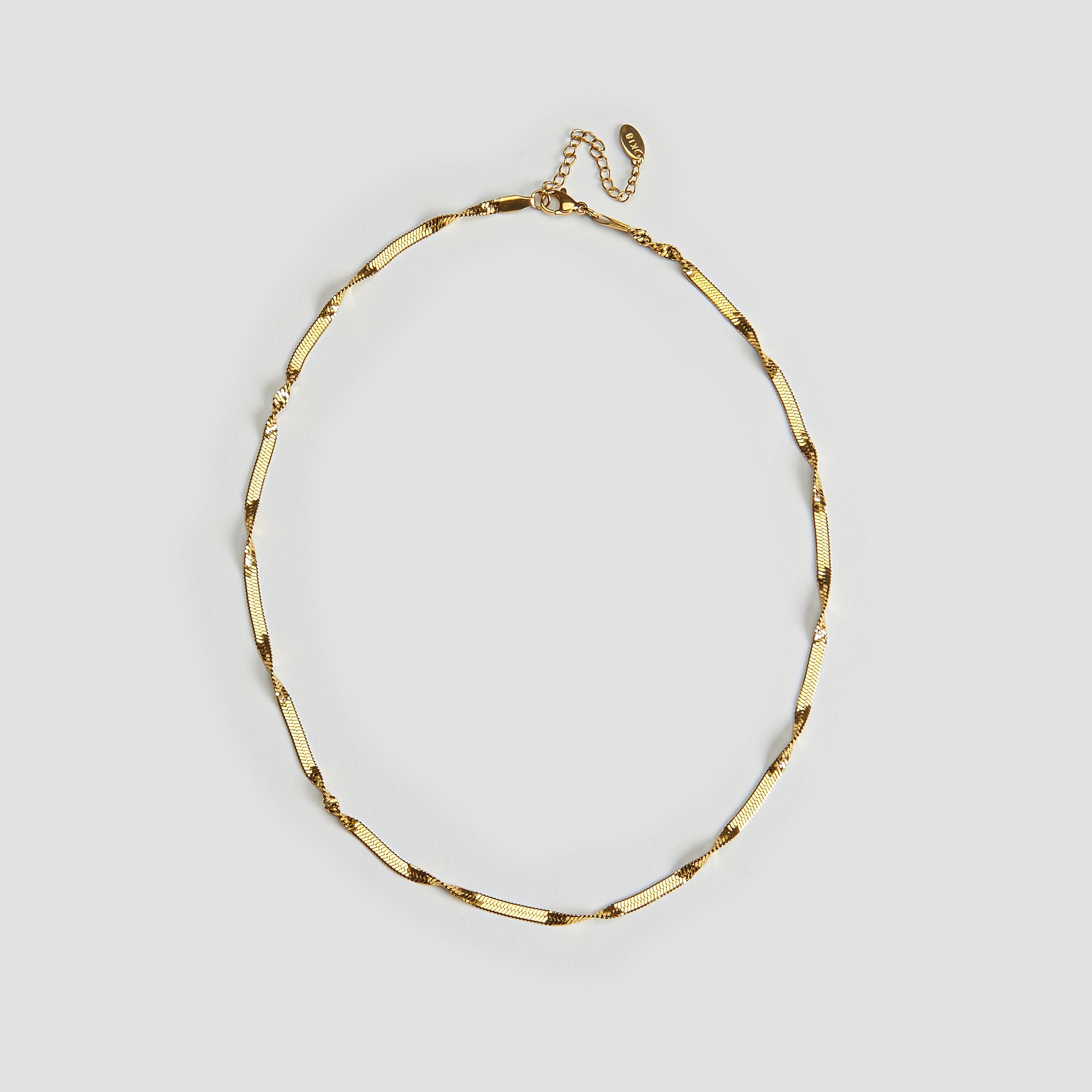 Full view of twisted snake chain gold necklace 18k gold plated stainless steel by GRISÉ NYC.