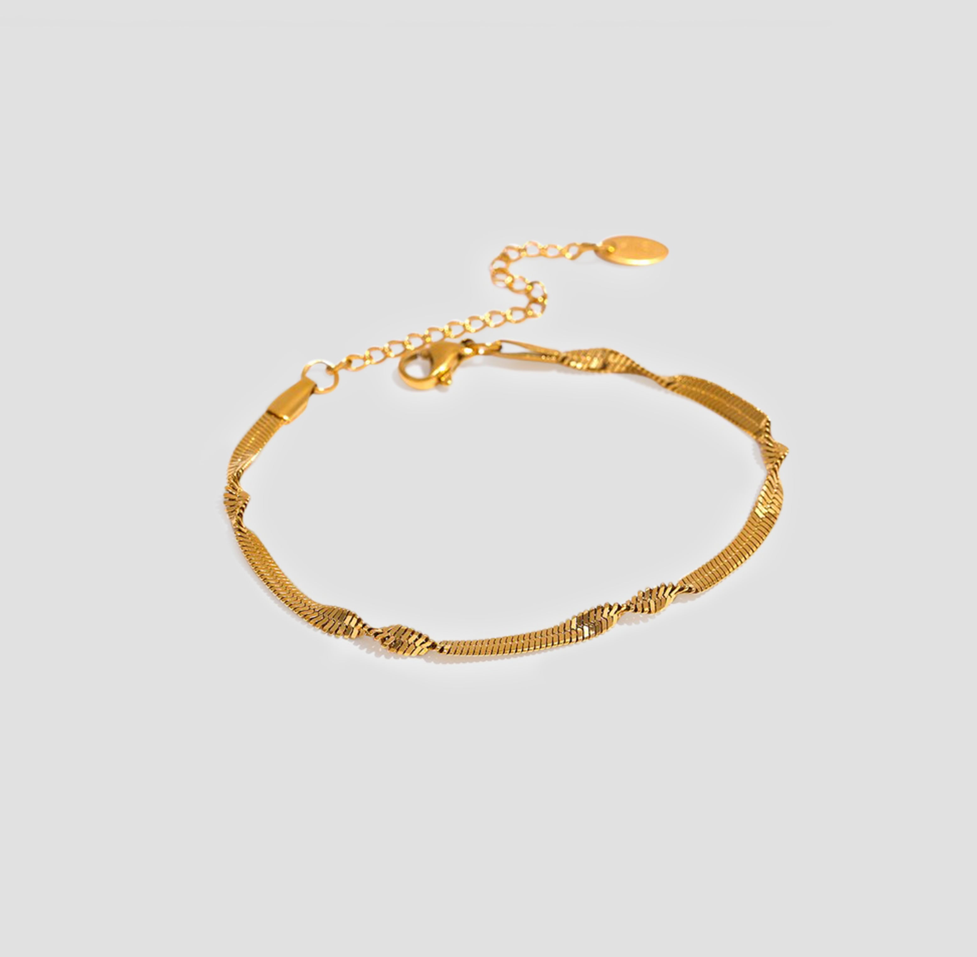 Twisted flat snake chain bracelet gold 18k plated stainless steel by GRISÉ NYC.