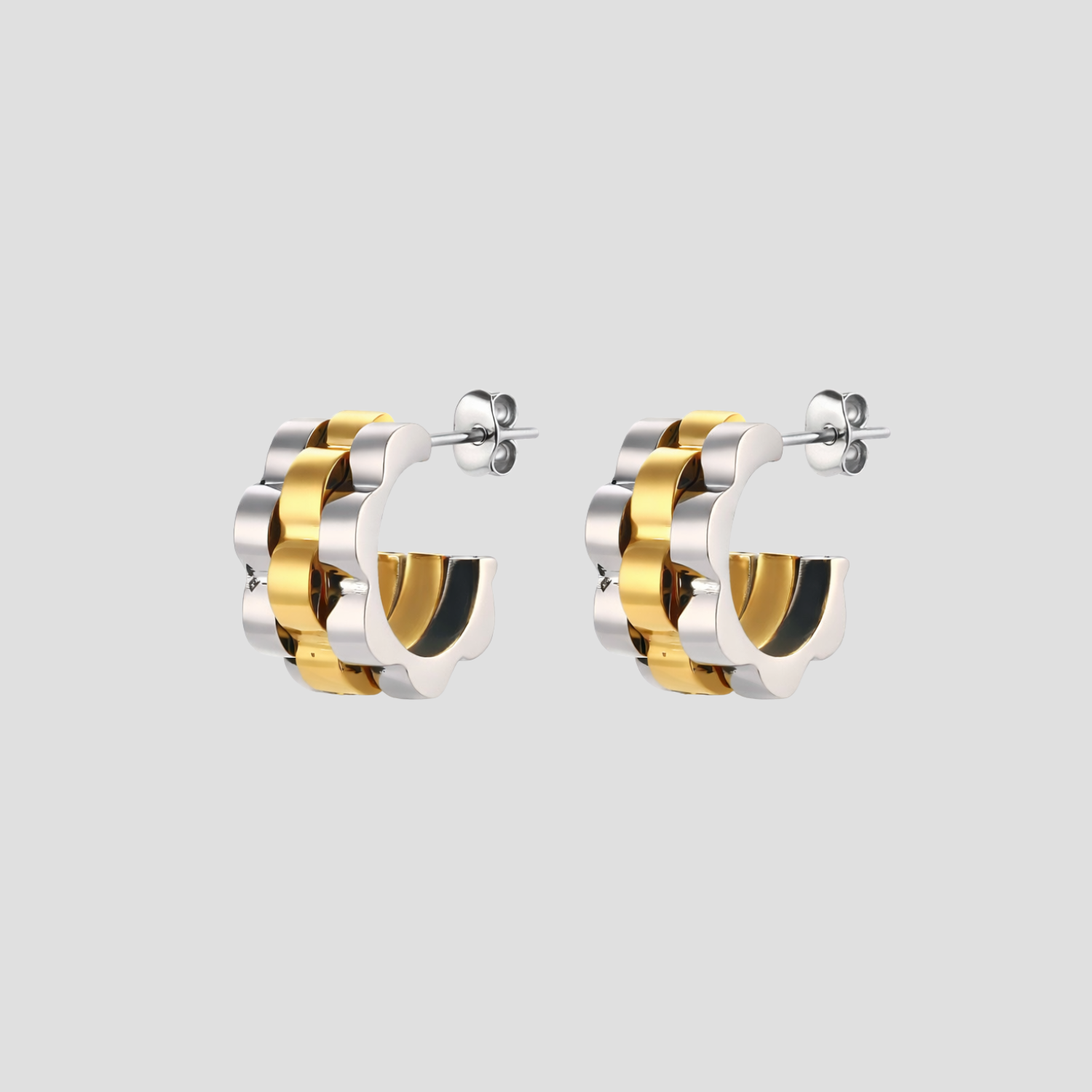 Midi Jubilee Link 2 tone hoop earrings in silver and 18k gold by GRISÉ NYC.