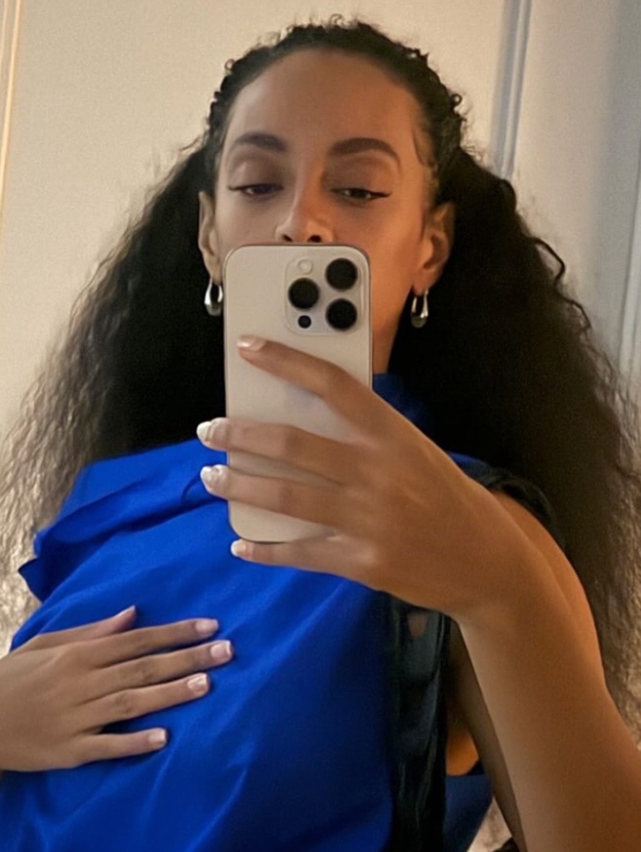 Sage resin oval stainless steel drop earrings by GRISÉ NYC with sculptural teardrop silhouette and silver hardware worn by Solamge Knowles.