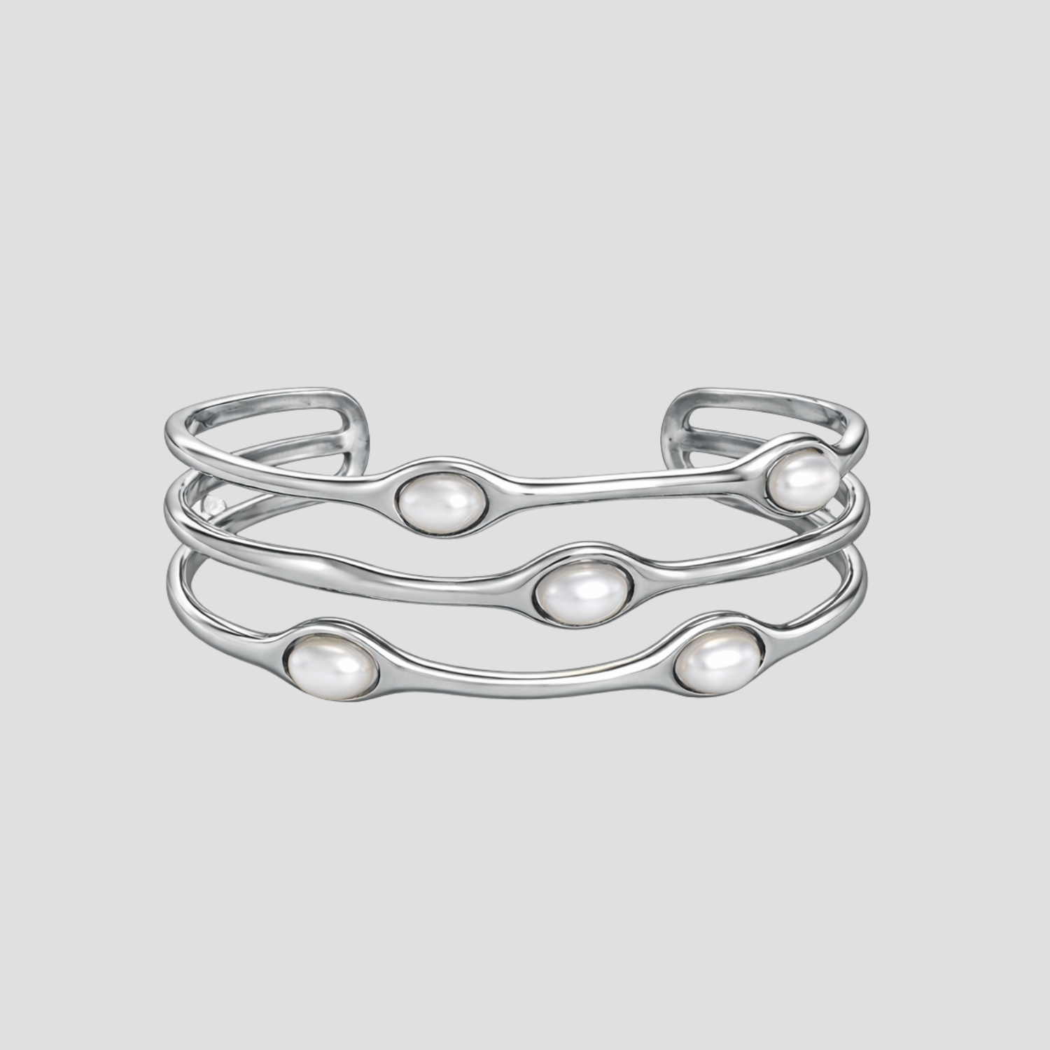Wavy Perlita steel cuff bracelet with pearl accents in silver by GRISÉ NYC.
