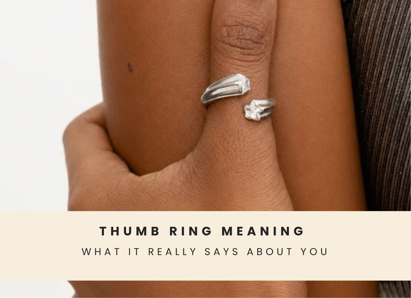 Close-up of a hand wearing a thumb ring