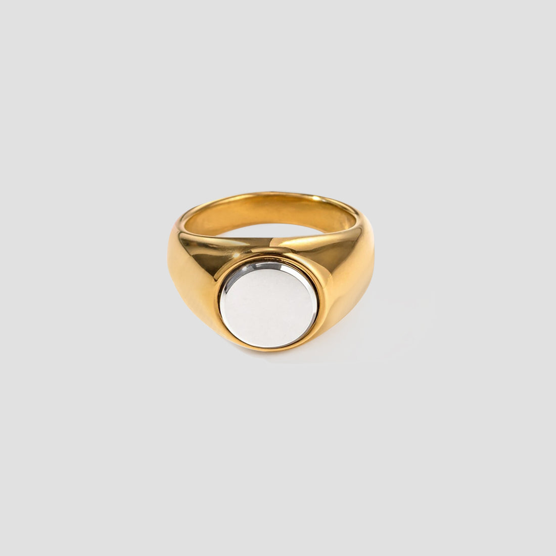 2-Tone Circle Ring by GRISÉ NYC featuring an 18k gold plated band with stainless steel circular center on a light grey background