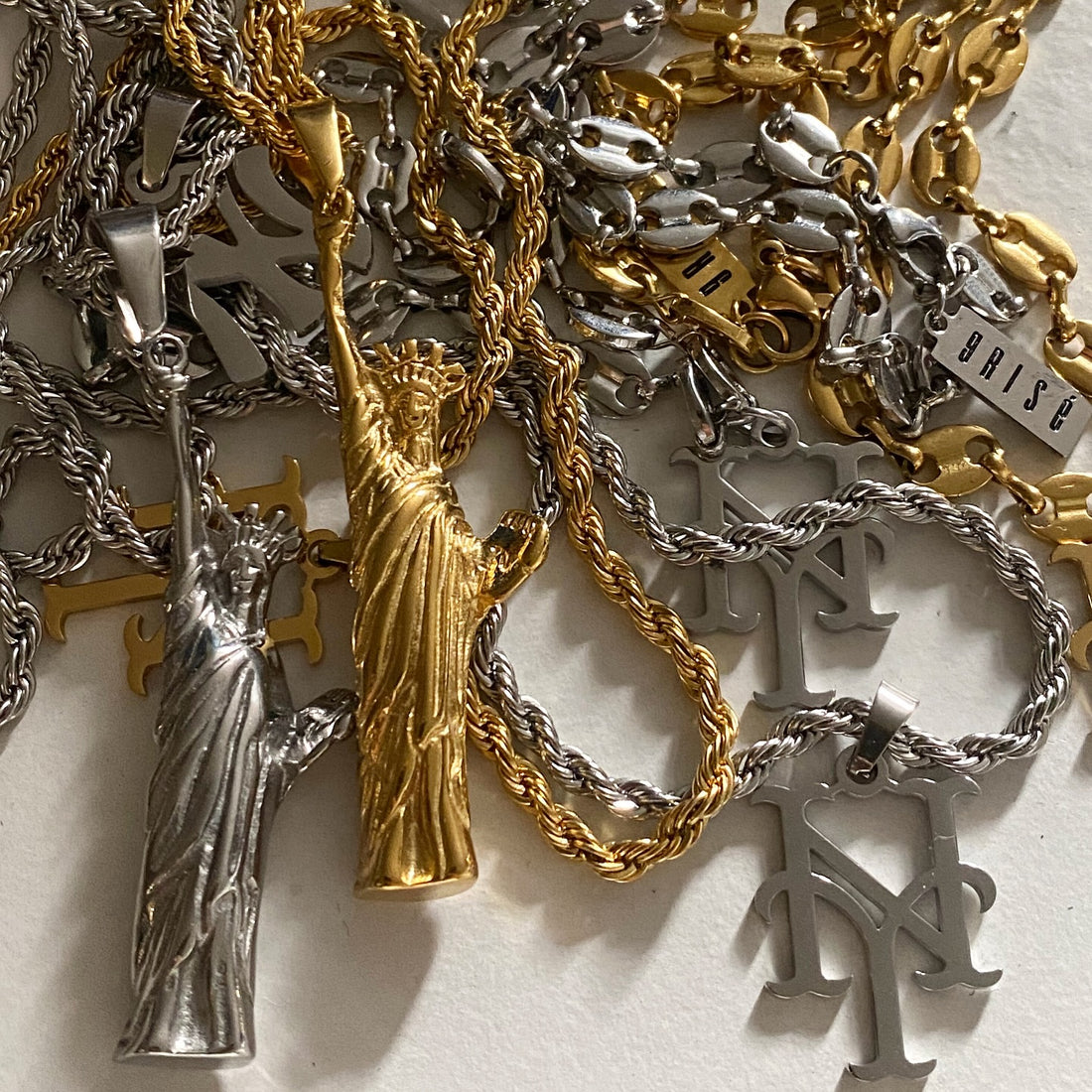 GRISÉ NYC Statue of Liberty pendant necklaces in 18k gold plated and stainless steel