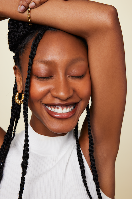 Model is wearing GRISÉ NYC Retro Geometric 18k Gold Earrings — sculptural gold-plated stainless steel hoops with bold vintage-inspired shape.