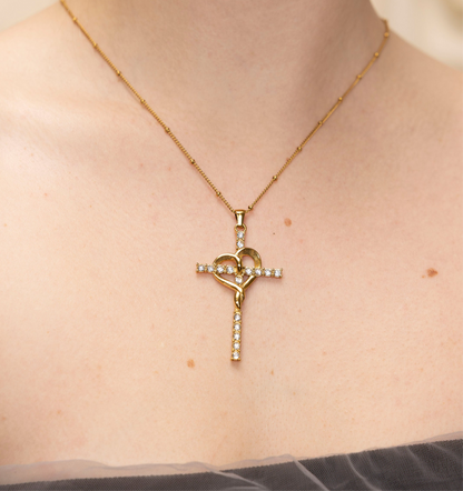 GRISÉ NYC Amour Cross Pendant Necklace worn on model 18k gold plated cubic zirconia