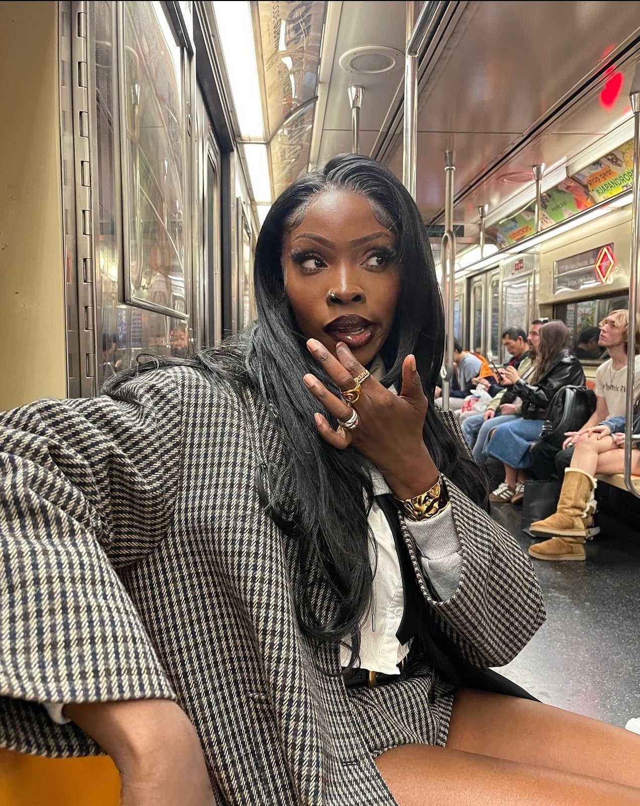 Aztec steel cuff bracelet by GRISÉ NYC worn by influencer on subway train in NYC.