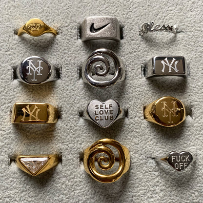 Blessed Ring in polished stainless steel displayed alongside GRISÉ NYC&