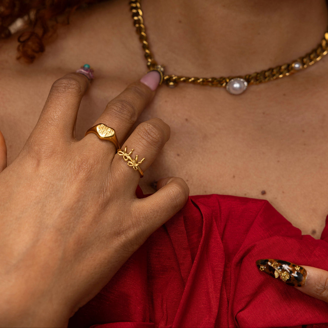 Model wearing the Dainty Double Croquette Bow Ring in 18k gold plated stainless steel styled with everyday jewelry by GRISÉ NYC.