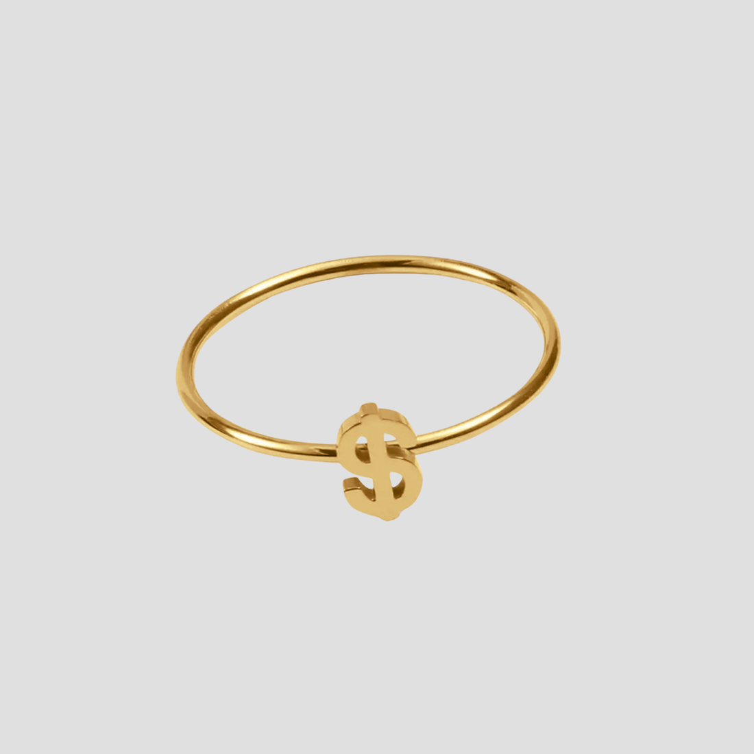 Dollar Sign Ring in 18k gold plated stainless steel featuring a minimalist dollar symbol design by GRISÉ NYC.