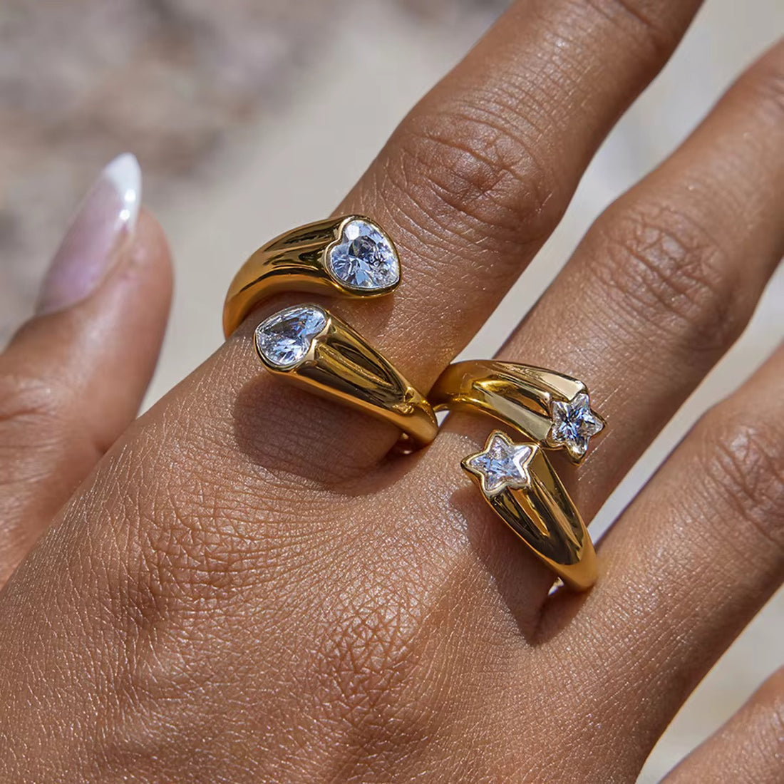 Model wearing Double Star Gemstone adjustable ring in 18k gold plated stainless steel by GRISÉ NYC.