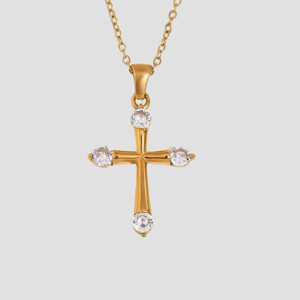 Eterna Cross Pendant 18K gold necklace featuring brilliant cubic zirconia on a polished gold-plated stainless steel chain by GRISÉ NYC.