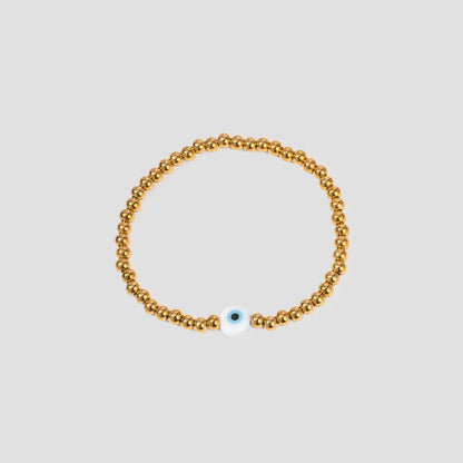 GRISÉ NYC Evil Eye Bead Bracelet in 18k gold plated stainless steel with blue protective evil eye charm.