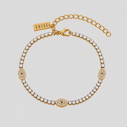 GRISÉ NYC Evil Eye Tennis Bracelet in 18k gold plated stainless steel with sparkling tennis stones.