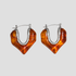 Silver molten heart amber resin hoop earrings on gray background