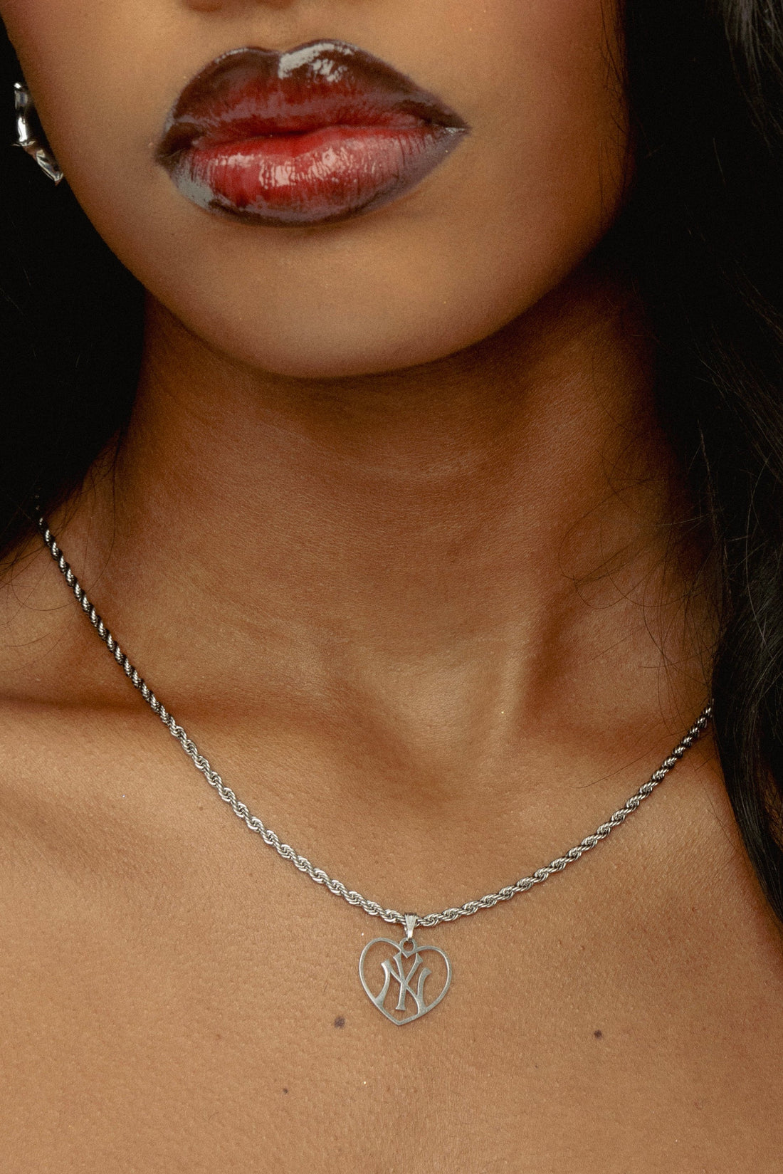 Heart shaped NY pendant necklace silver tone