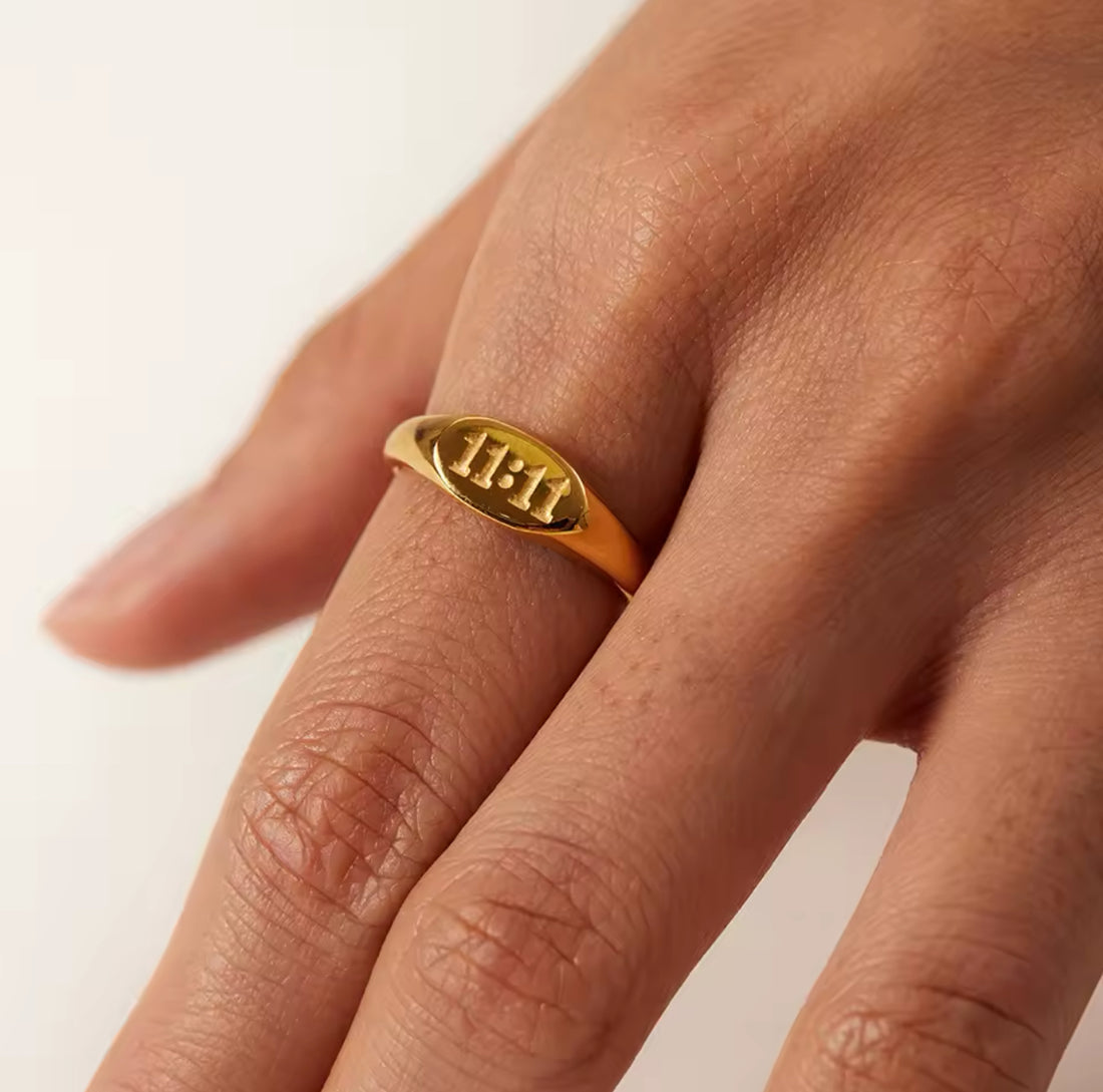 Model wearing GRISÉ NYC 18k gold 11:11 signet ring