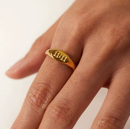 Model wearing GRISÉ NYC 18k gold 11:11 signet ring