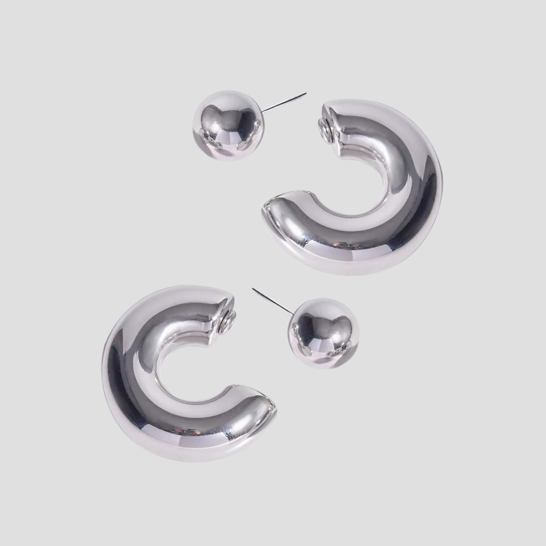 GRISÉ NYC 2-in-1 Bold Midi Steel Earrings with detachable ball and polished reflective finish.