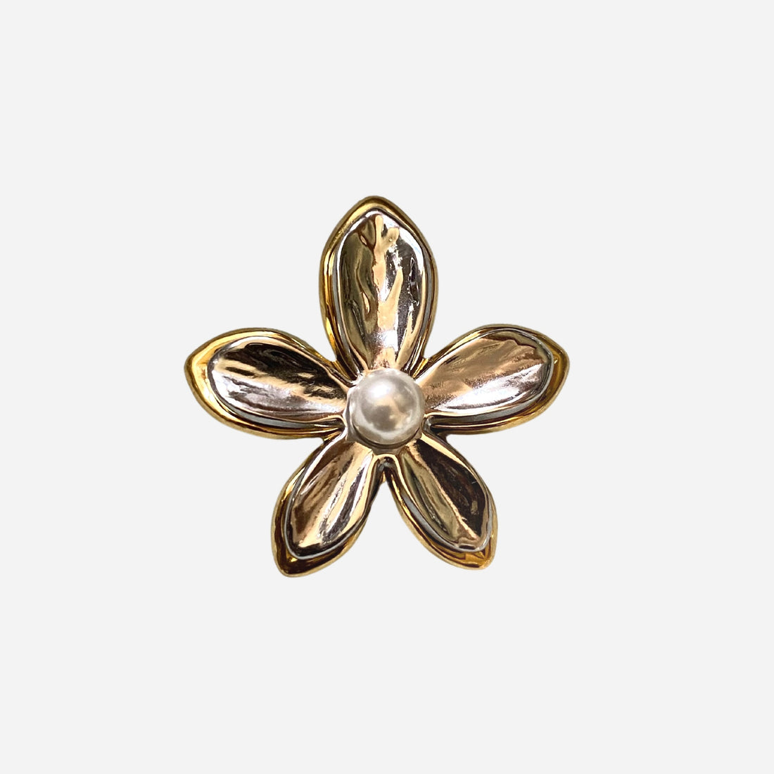 Flat lay of GRISÉ NYC 2-tone flower pearl gold plated ring