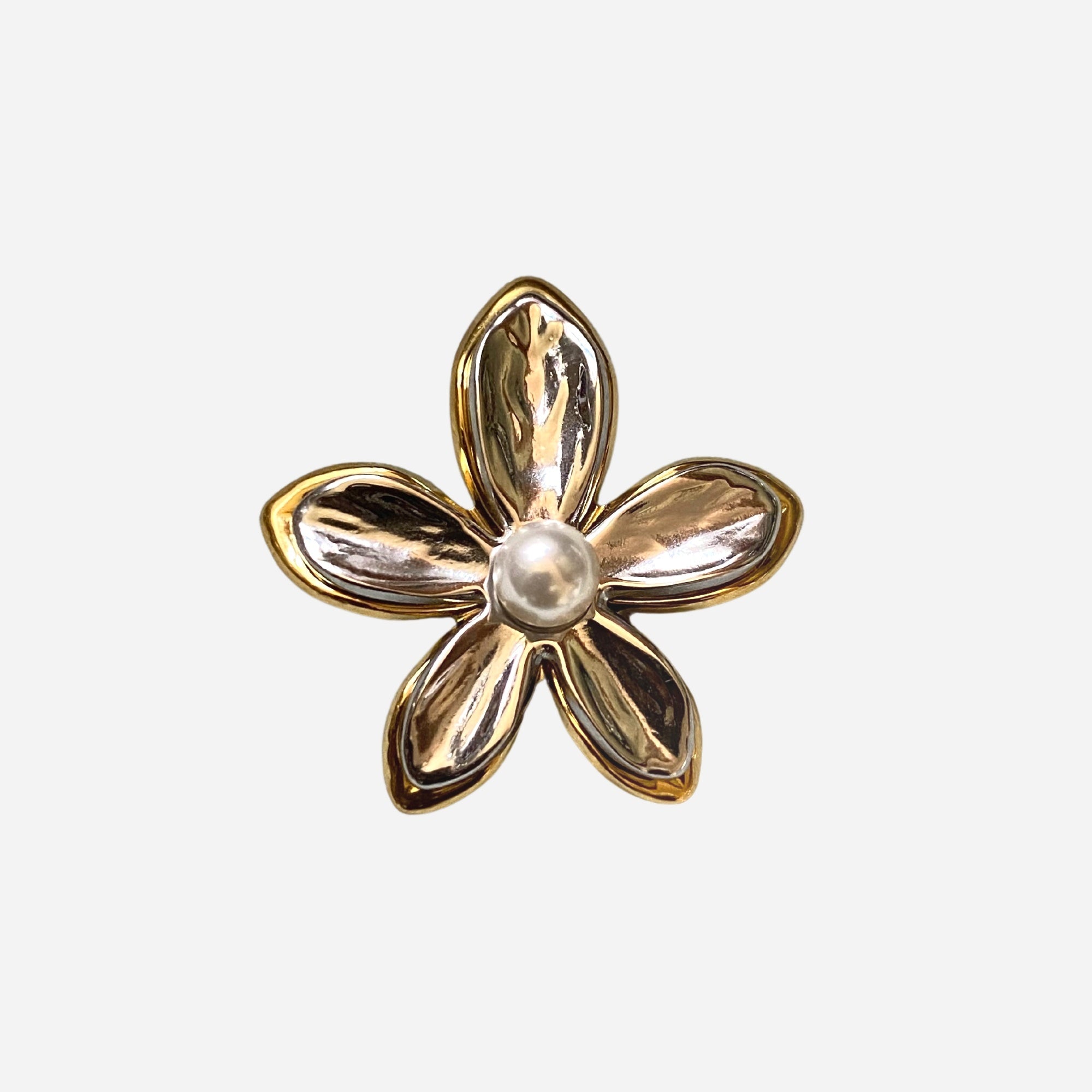 Flat lay of GRISÉ NYC 2-tone flower pearl gold plated ring