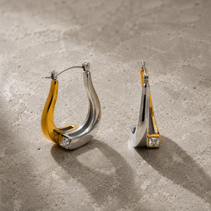 Detail shot of GRISÉ NYC teardrop earrings with cubic zirconia accent.