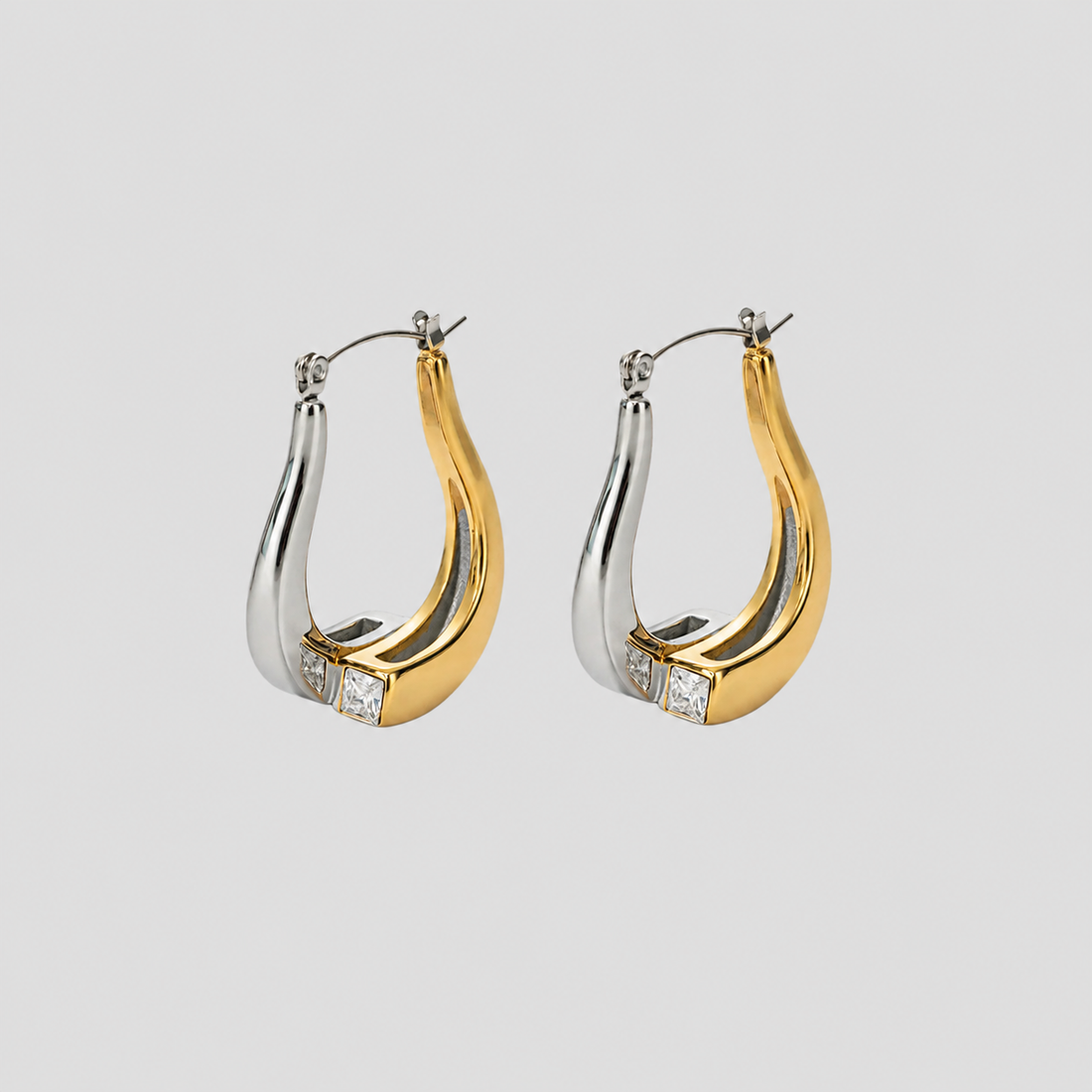 Flat lay of GRISÉ NYC 2-tone gemstone teardrop earrings.