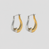 Flat lay of GRISÉ NYC 2-tone gemstone teardrop earrings.