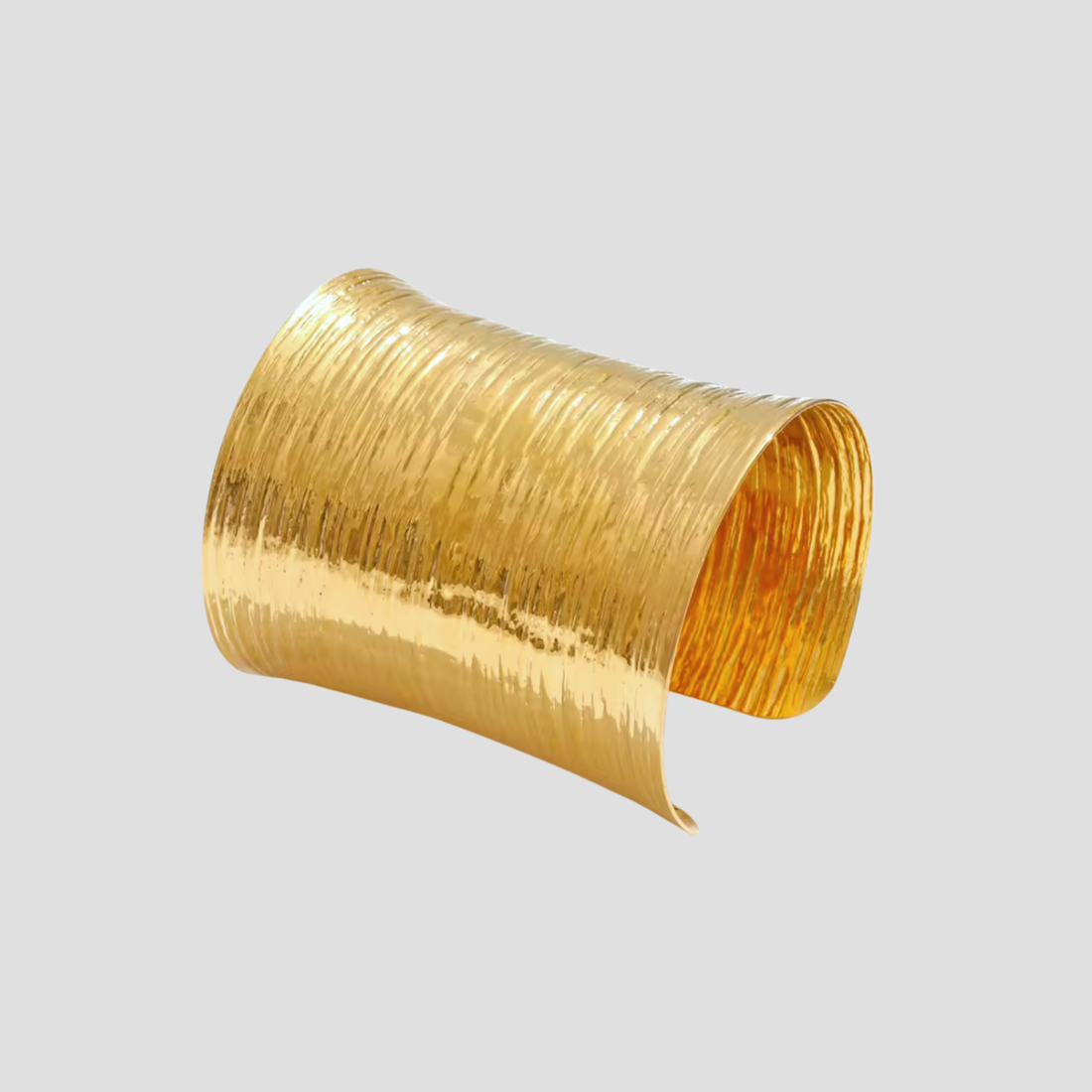 Armor 18k gold cuff bracelet by GRISÉ NYC with hammered texture and bold design.