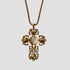 GRISÉ NYC baroque 18k gold cross pendant necklace with vintage filigree detail, laid flat.