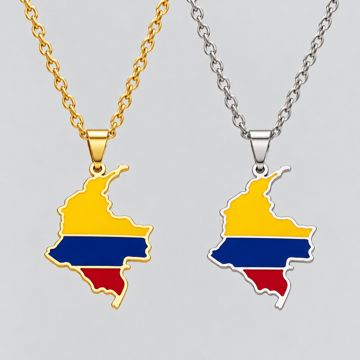 GRISÉ NYC Colombia flag map pendant necklaces in gold and silver, featuring yellow, blue, and red enamel detailing on matching stainless steel chains.