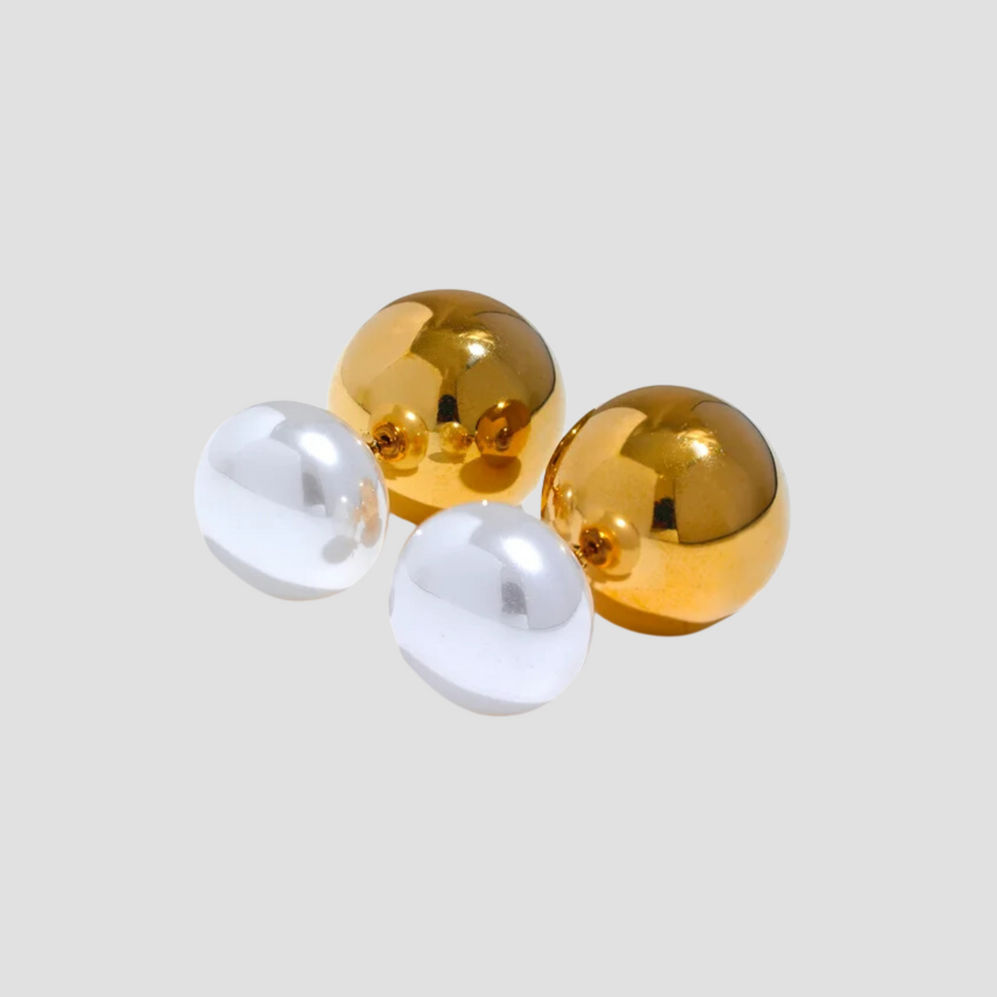 GRISÉ NYC convertible pearl stud earrings in 18k gold plated stainless steel.