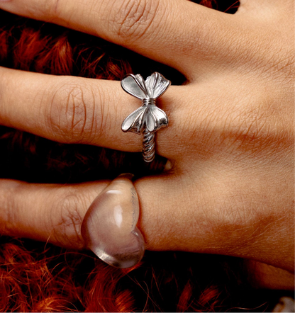 Model wearing GRISÉ NYC Croquette bow ring with agate ring stack.