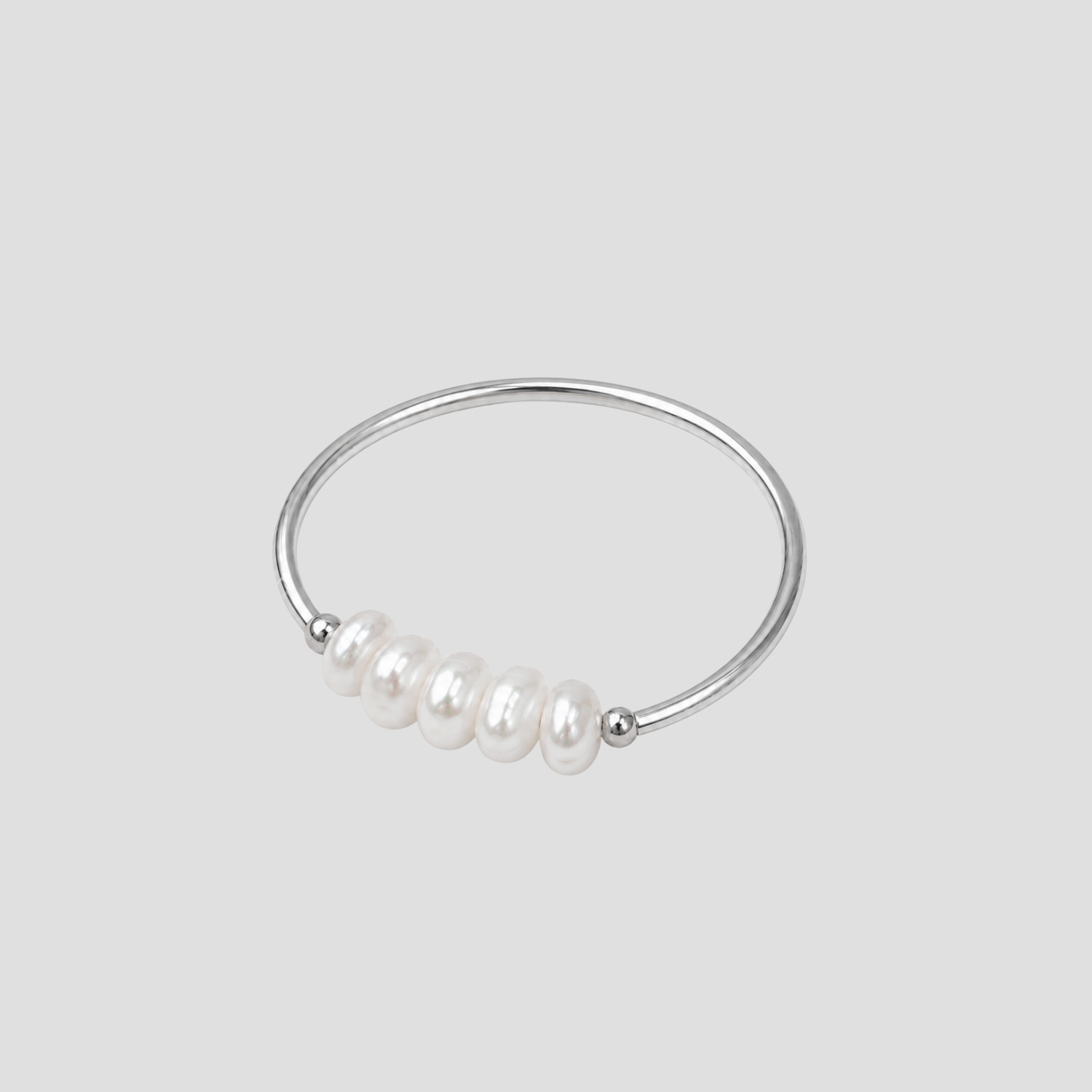 Dainty Freshwater Pearl Ring in polished stainless steel featuring genuine freshwater pearls on a minimalist silver band by GRISÉ NYC.