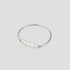Dainty Freshwater Pearl Ring in polished stainless steel featuring genuine freshwater pearls on a minimalist silver band by GRISÉ NYC.