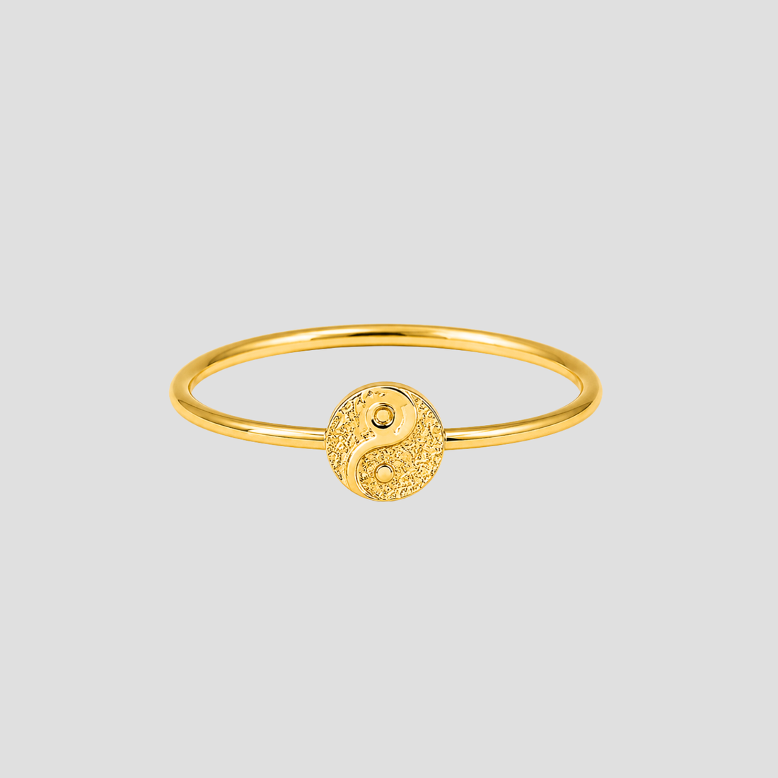 GRISÉ NYC Dainty Ying Yang 18k Gold Ring in 18k gold plated stainless steel featuring a textured yin yang symbol on a slim minimalist band.