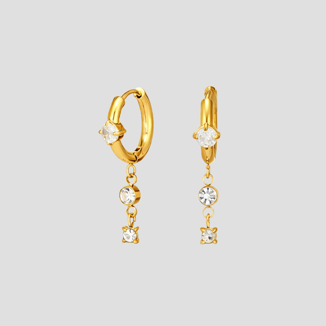 GRISÉ NYC dangle gemstone hoop earrings in 18k yellow gold with cubic zirconia drop stones.